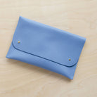 Leather clutch bag in powder blue