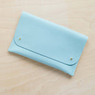 Leather clutch bag in powder blue colour