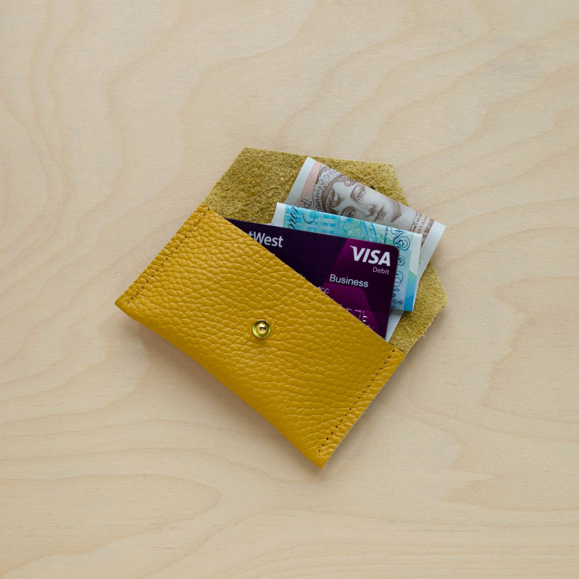 Mustard Yellow card holder in use.