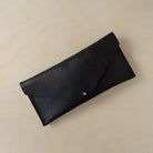 The leather clutch purse in black