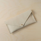 The leather clutch purse in cream