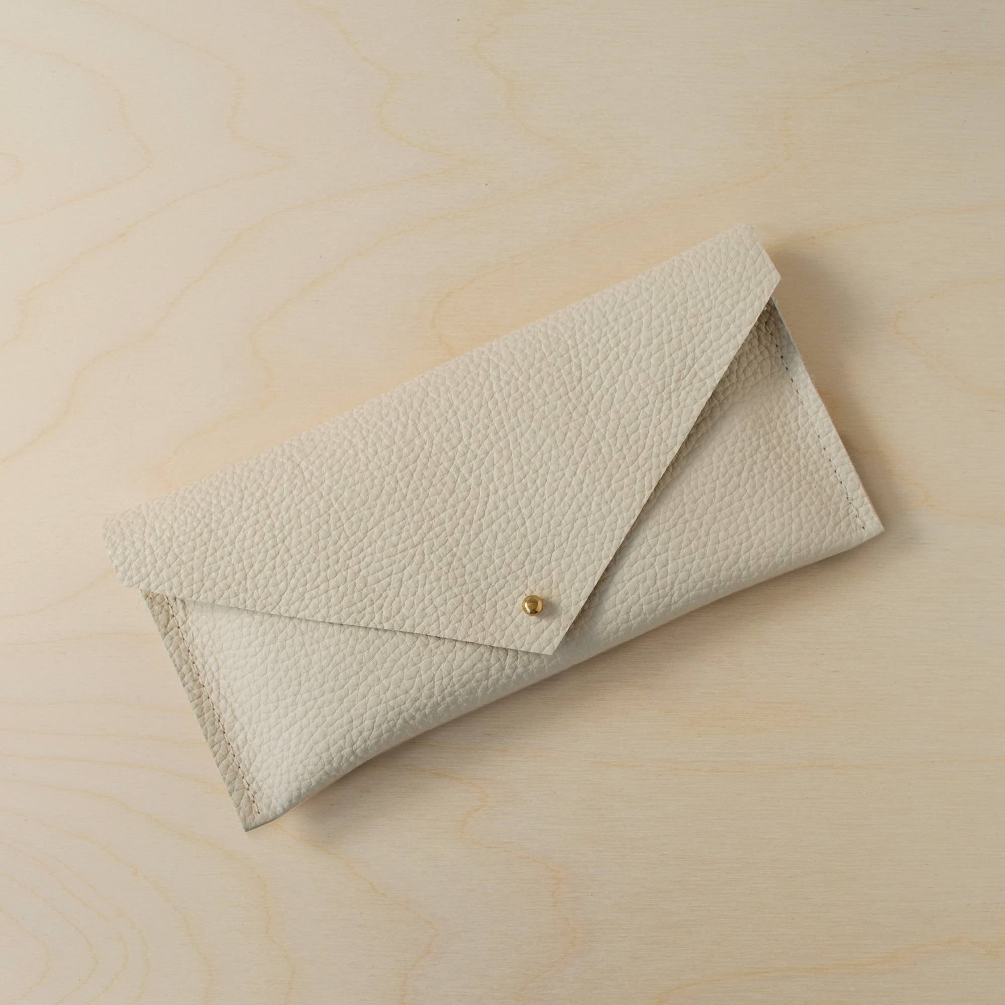 The leather clutch purse in cream