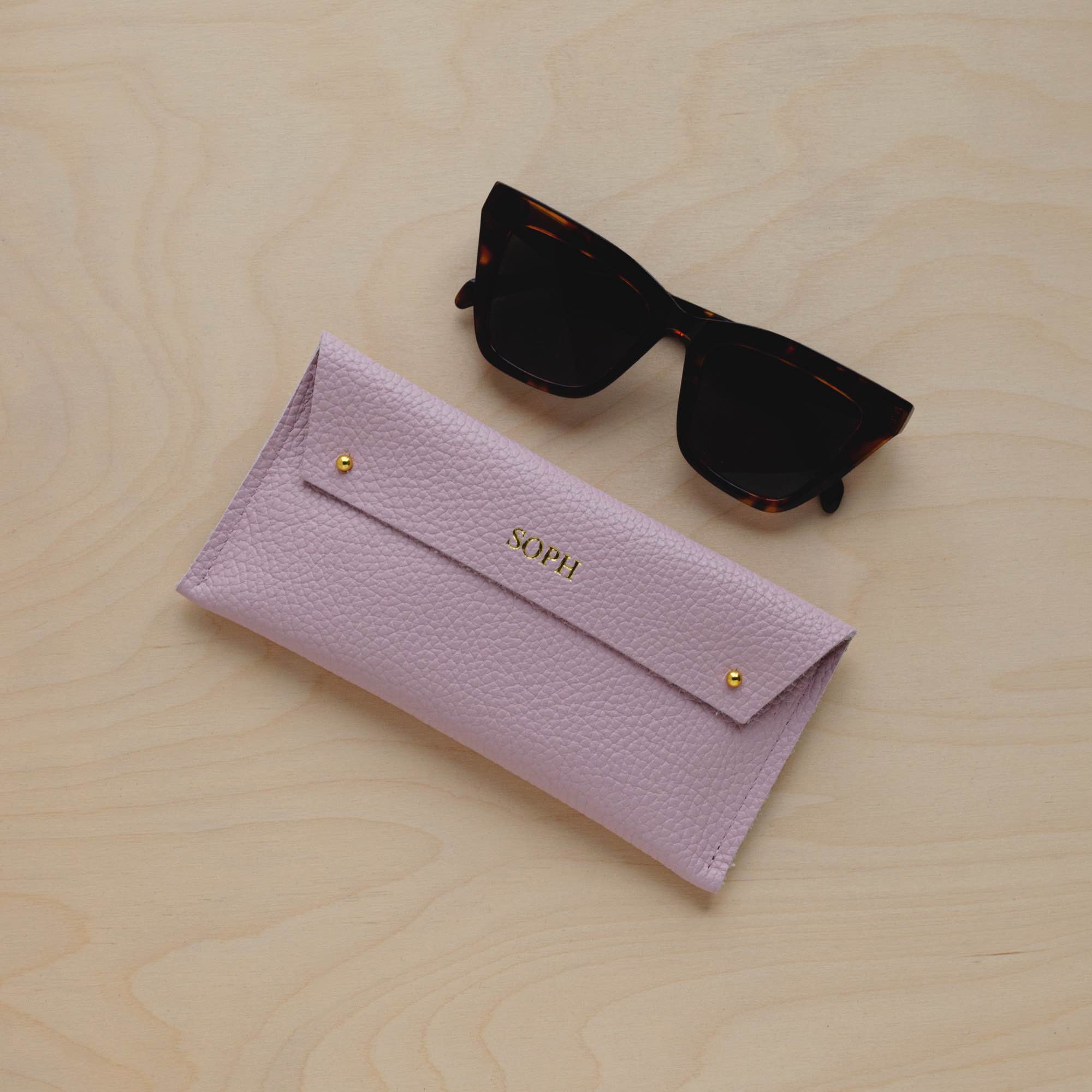 Personalised Leather Double stud glasses case in baby pink with sunglasses.