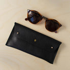 black glasses case personalised with the letter E.