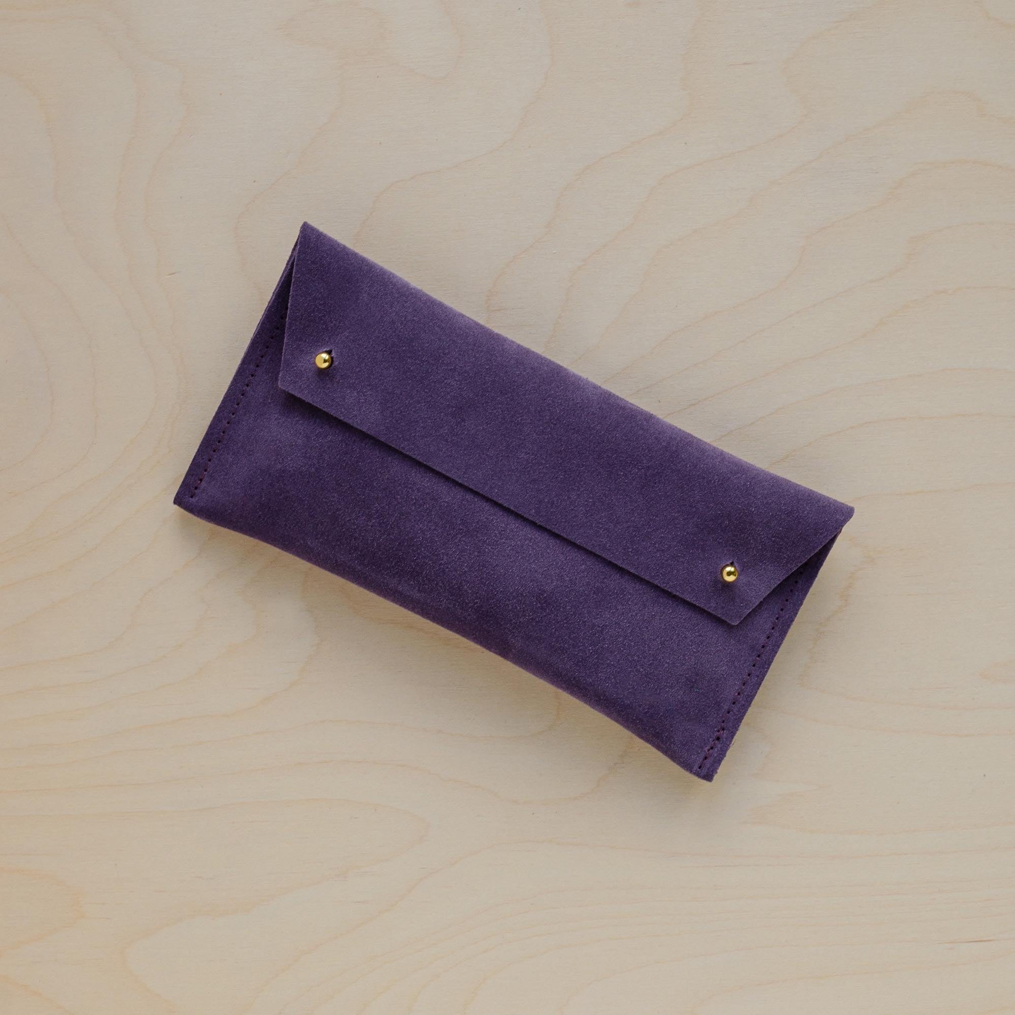 The suede pen case in Grape Purple. Featuring a double stud. 