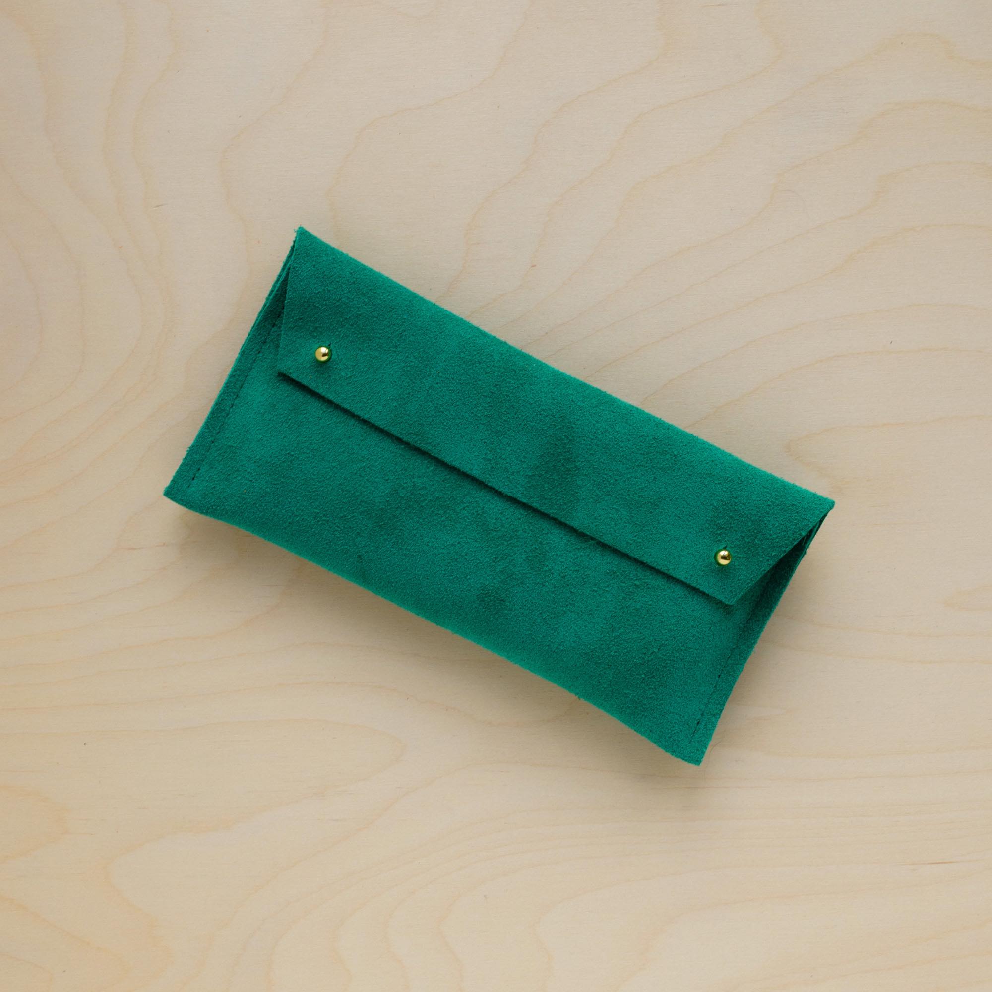 The suede pen case in Jade Green. Featuring a double stud. 