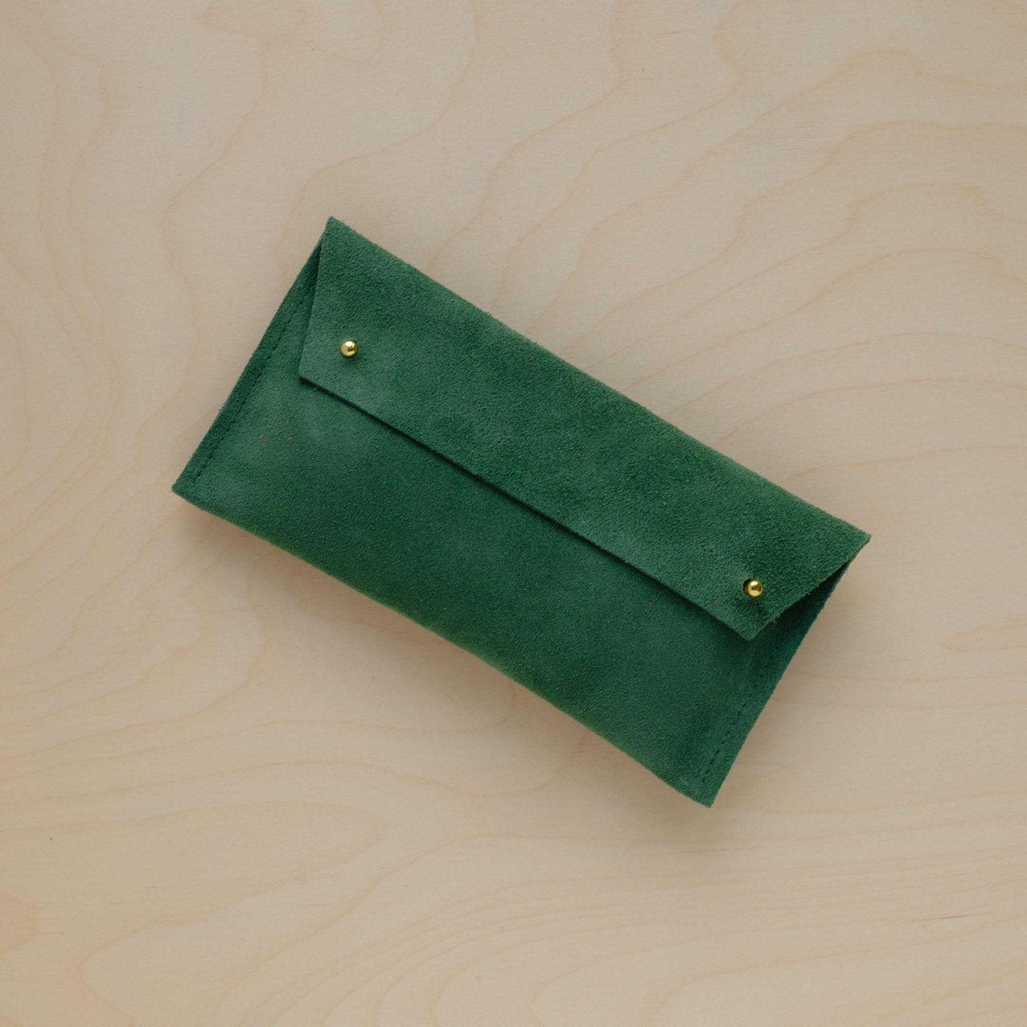 The suede pen case in Moss Green. Featuring a double stud. 