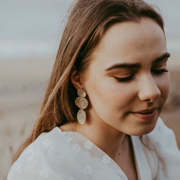 Kensa Gold Leather Earrings worn by boho bride.