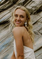 Statement Pearl White Bridal Earrings worn by bride at a coastal, beach wedding.