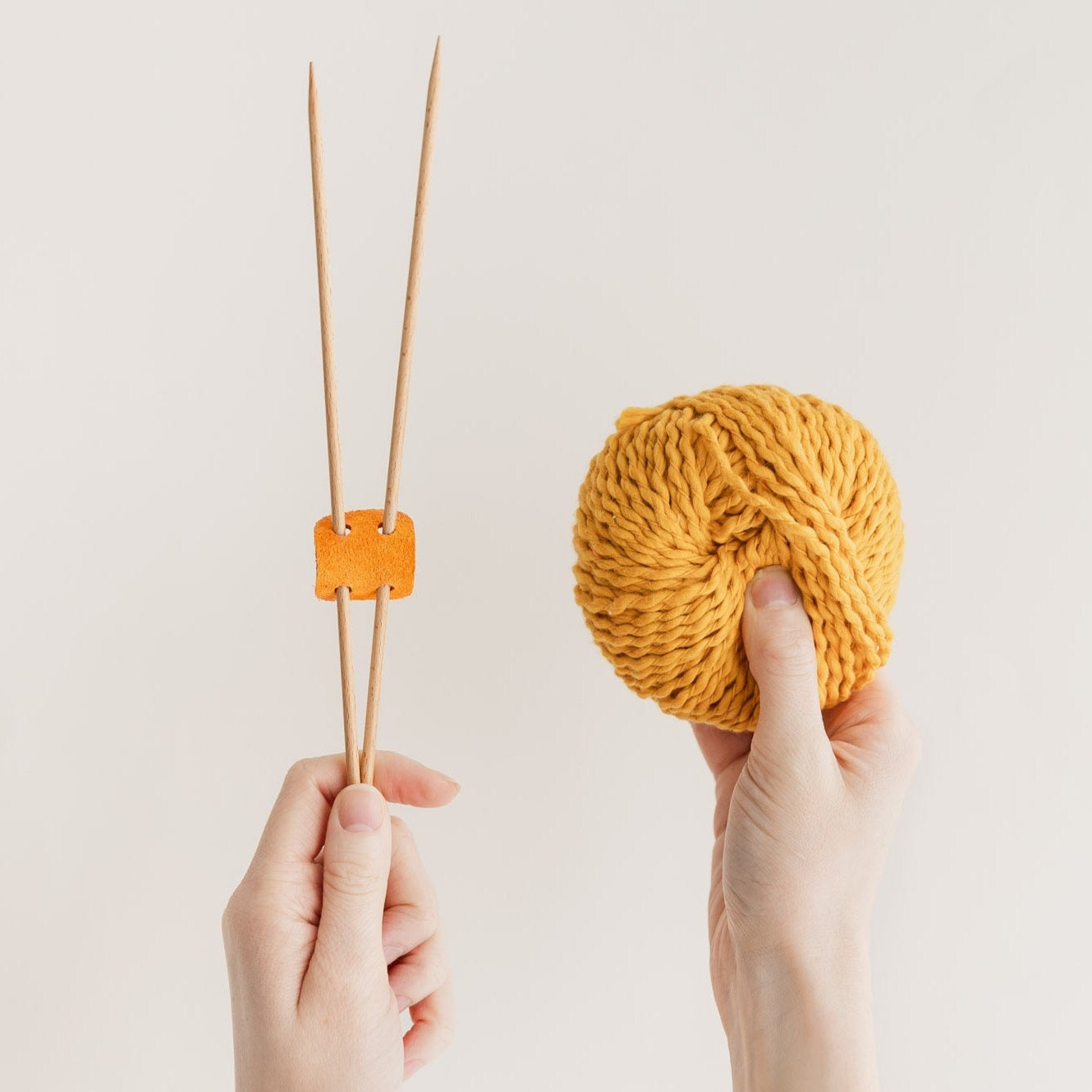 Orange suede knitting needle holder