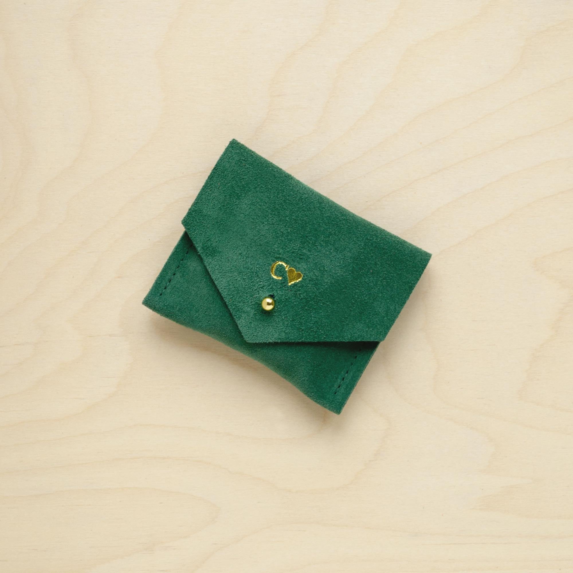 A suede Stitch Markers pouch in  Moss Green. Complete with a stud for secure closing. This pouch has been personalised with initial and love heart.