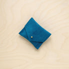 A suede Stitch Markers pouch in Teal Green. Complete with a stud for secure closing.