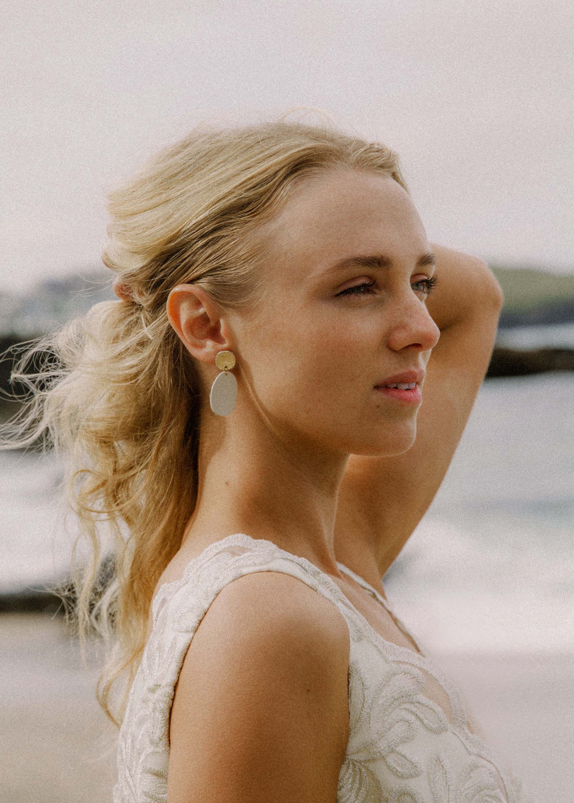 Maia Leather Earrings worn by bride on a beach.