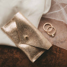 Couples ring pouch in shimmer gold leather.