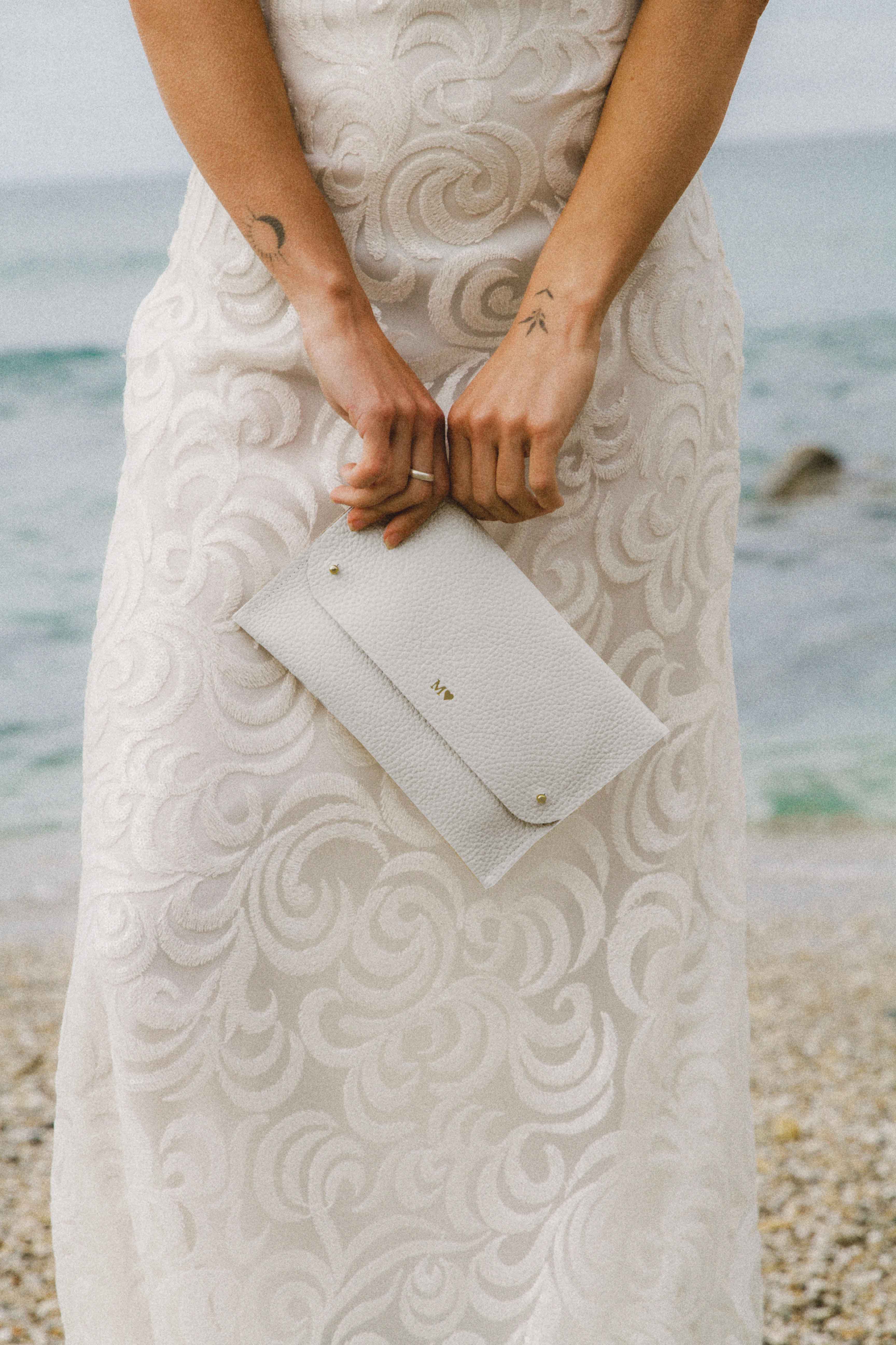 White leather bridal clutch bag with brides initials.