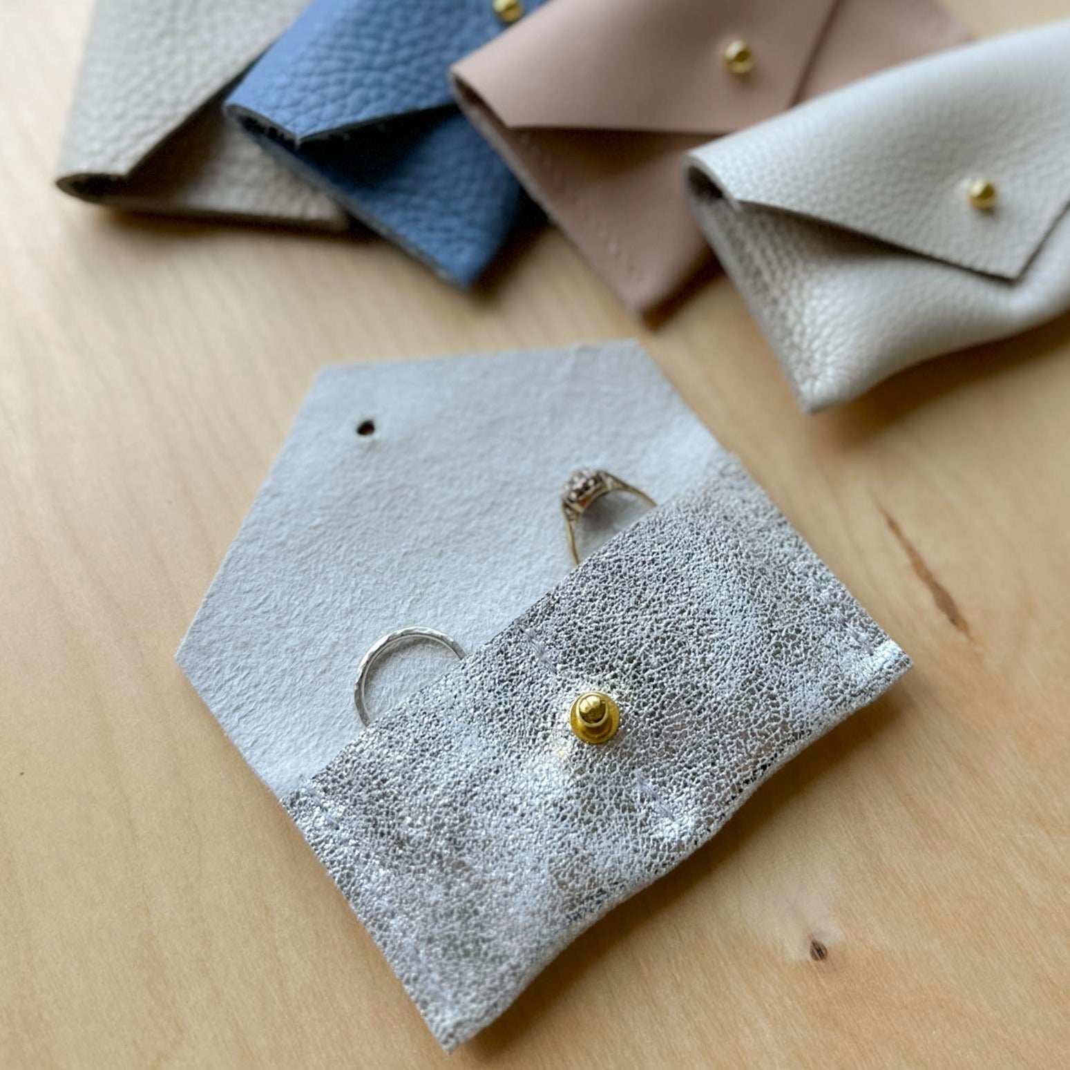 Silver wedding ring pouch, with a pocket for each ring.