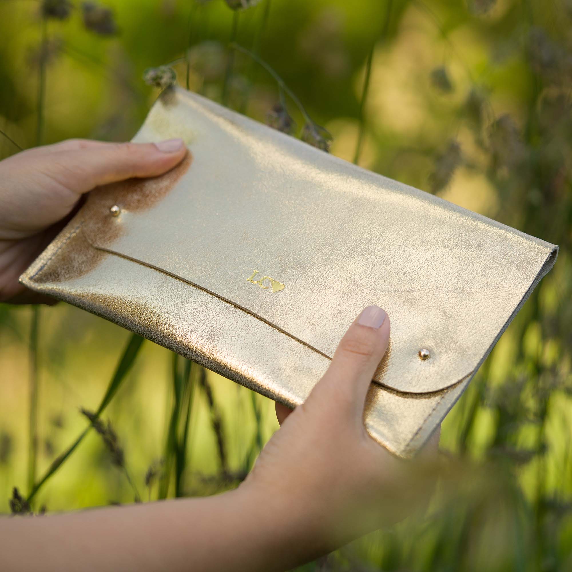 Gold shimmer clutch discount bag