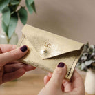 Gold leather personalised card holder.