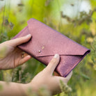 Personalised leather clutch purse in metallic berry purple, personalised with he initial E.