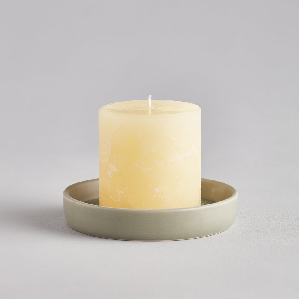 St Eval Light Green Candle Plate with St Eval Pillar Candle in it.