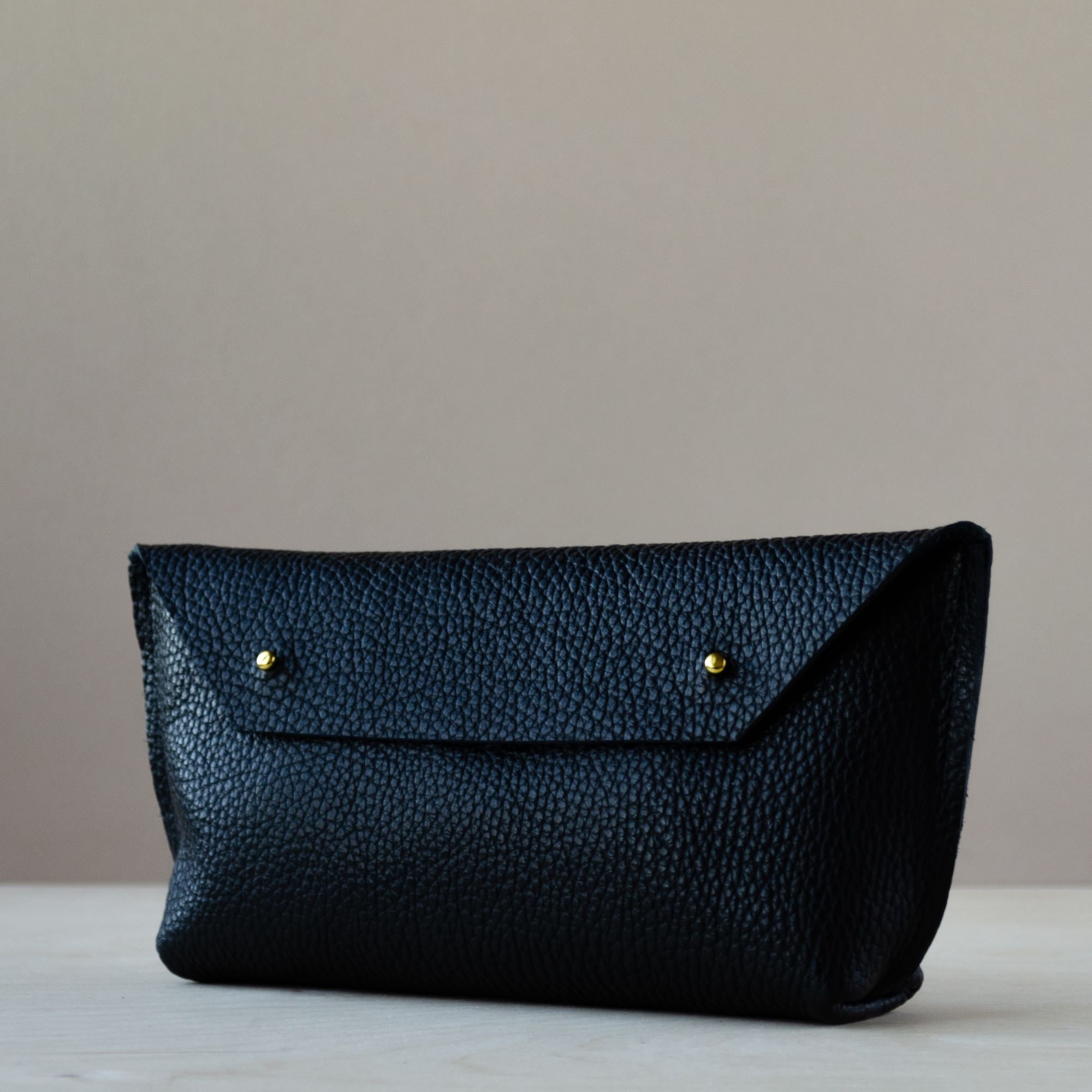 Black Leather Clutch Bag with Gold Fastenings